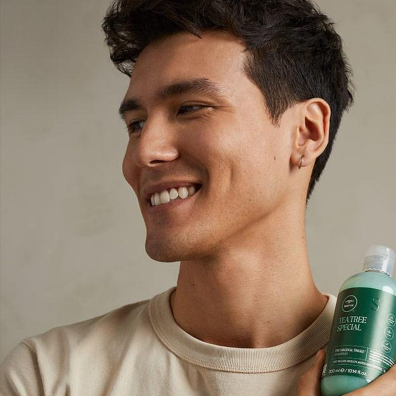 Paul Mitchell range at The Color — model holding Tea Tree Special Shampoo