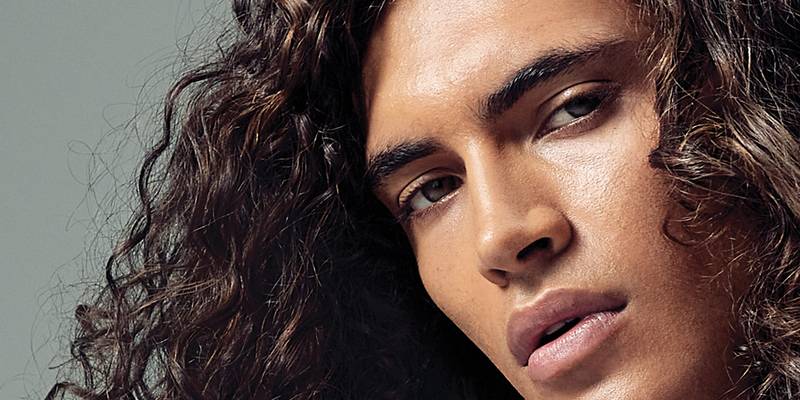 Model with shoulder-length dark curls — Paul Mitchell Classic