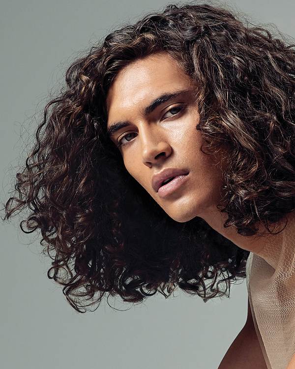 Model with shoulder-length dark curls — Paul Mitchell Classic