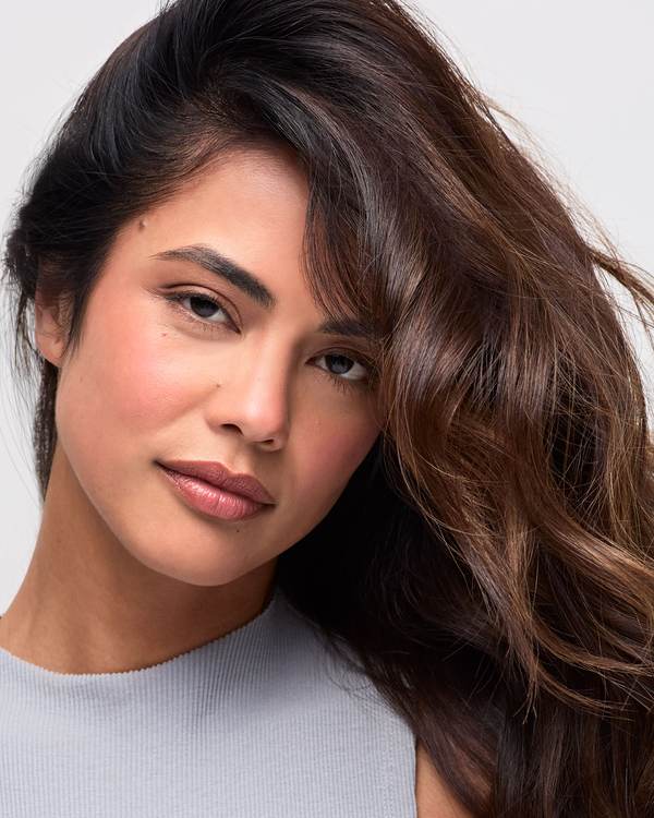 Model with long, glossy brown waves — Paul Mitchell Clean Beauty Hydrate